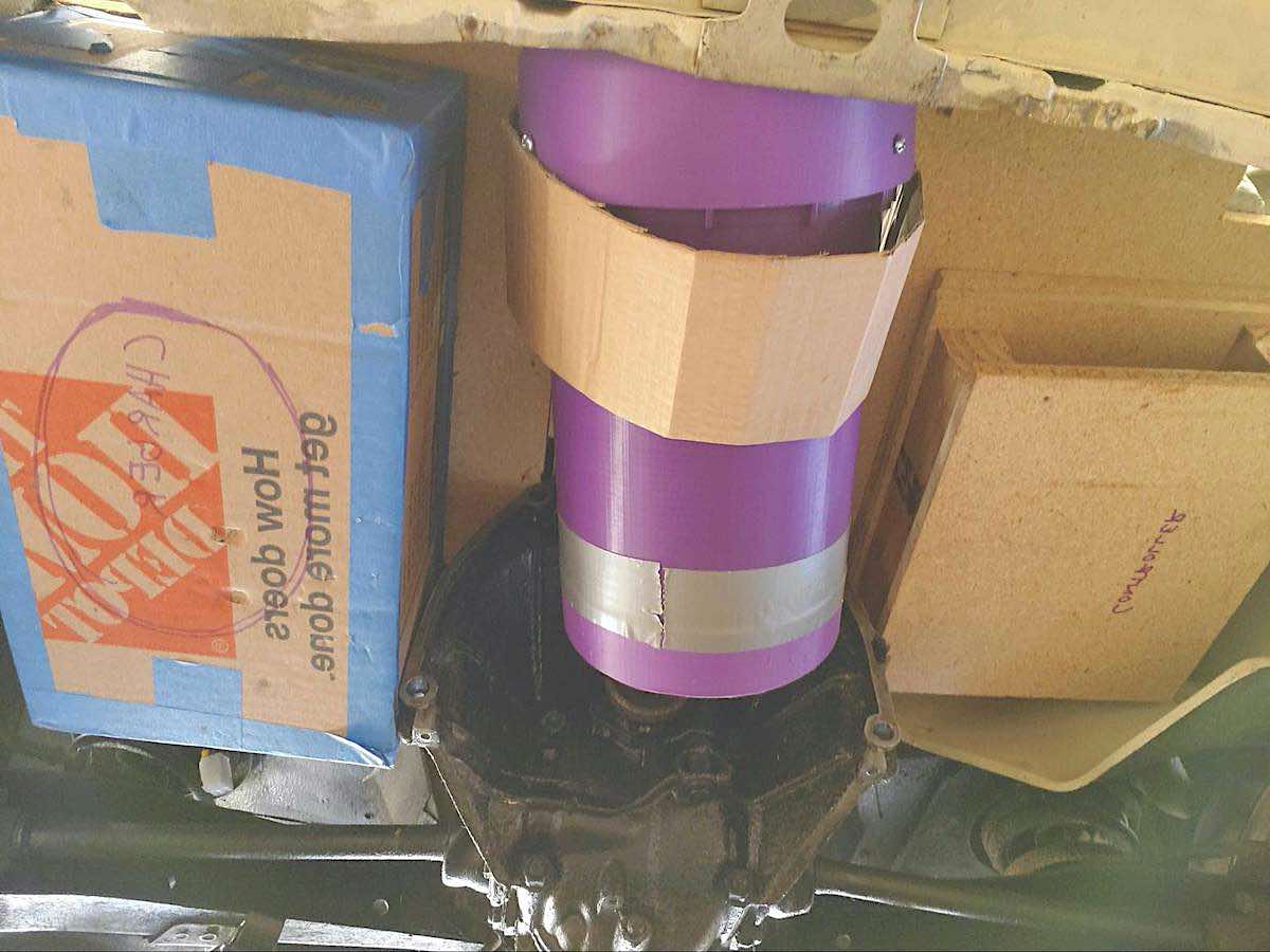 image of a purple, 3d printed mockup of an electric motor with cardboard mockups of controller and charger in a fiat 500 rear trunk