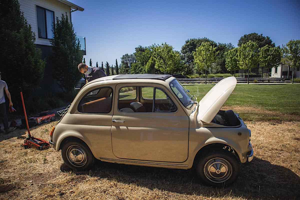 Image of tan colored 1966 fiat 500 with the front trunk open